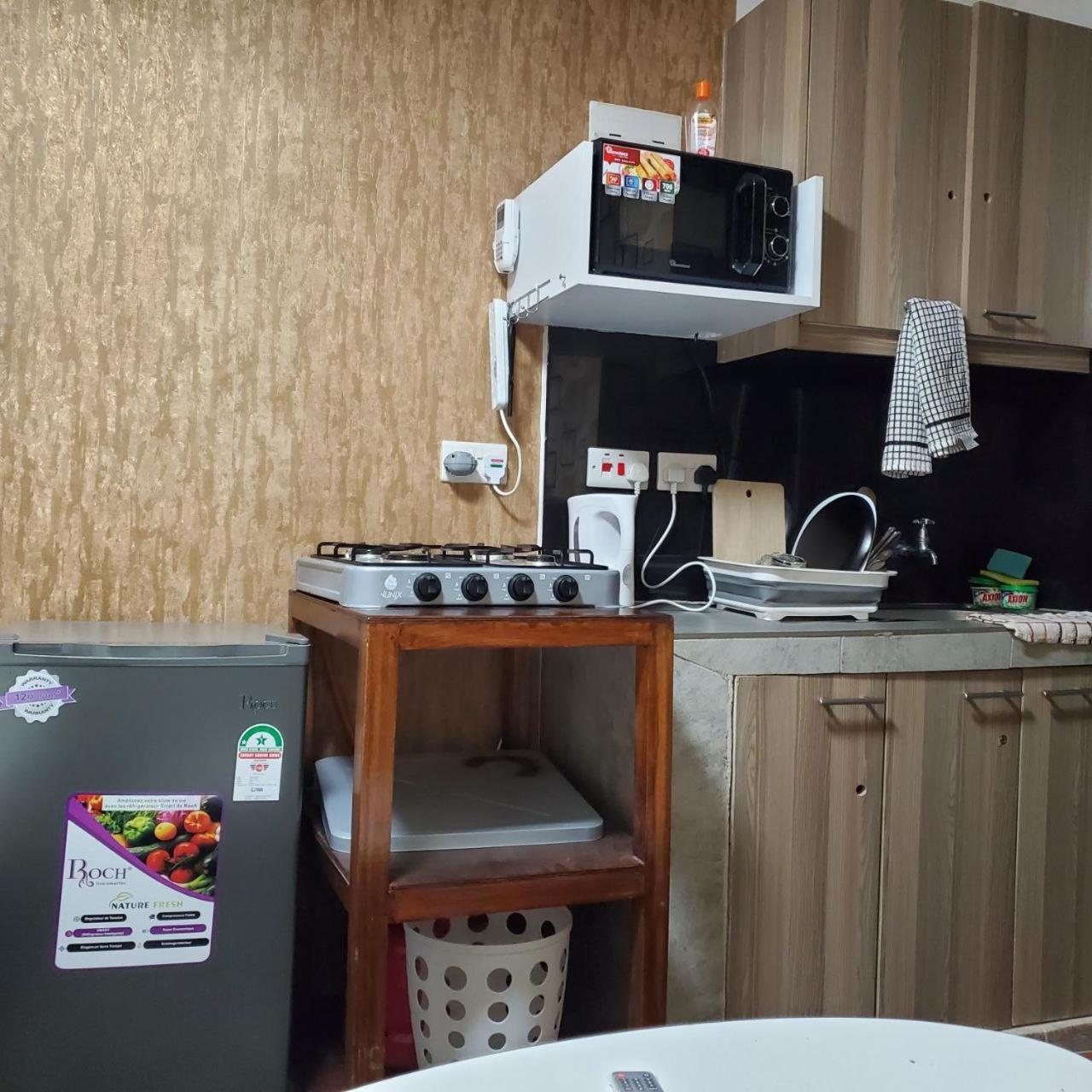 Apartamento Lovely & Cozy Compact Studio Near Airport With Rooftop View Nairobi Exterior foto